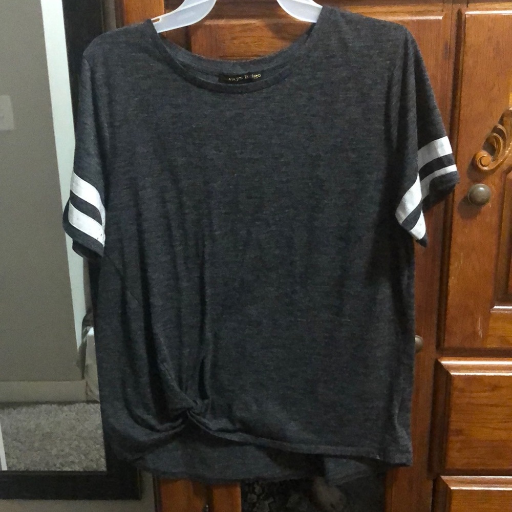 Gray and white shirt with a knot in the bottom.